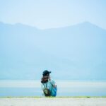 calm person meditating outdoors
